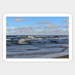 White cumulus clouds in sky over wavy Baltic sea Sticker